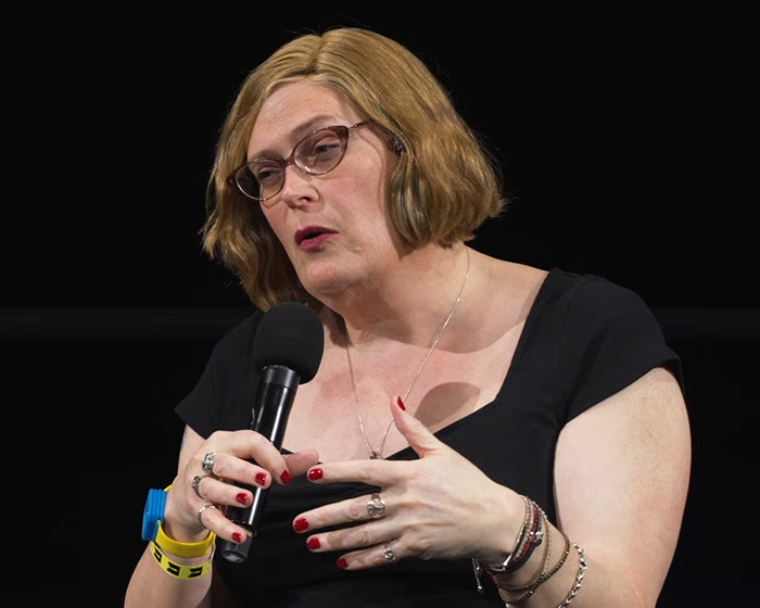 Director Lilly Wachowski speaks at an event, contributing to Hollywood conversations. Director Lilly Wachowski speaks at an event, contributing to Hollywood conversations.