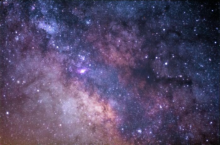 A breathtaking view of the Milky Way galaxy, filled with countless stars and nebulae, highlighting cool facts about the universe.