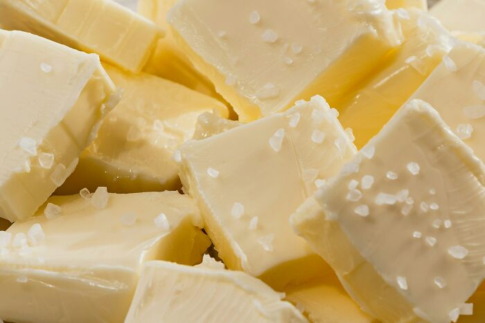 Close-up of salted butter cubes, representing daily life expenses amid job market struggles