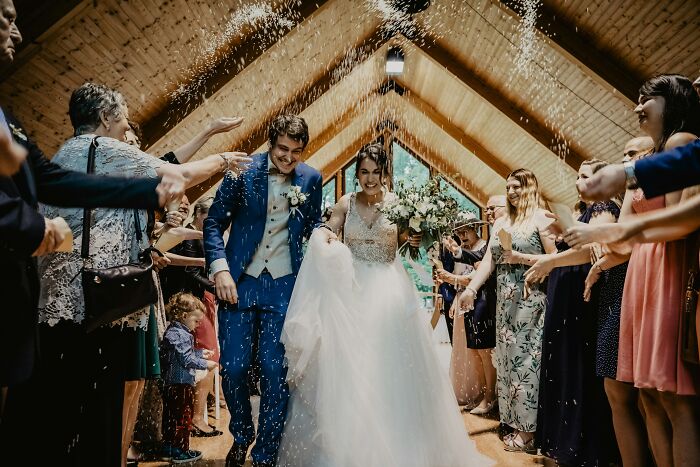 Newlywed couple celebrating, hoping for a bright future despite a tough job market