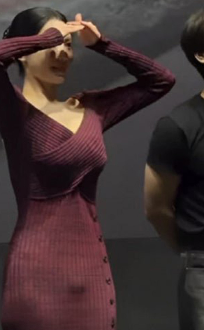 Johyun poses with hands above her head, highlighting her unexpected styling at Karlovy Vary VIP premiere. Johyun poses with hands above her head, highlighting her unexpected styling at Karlovy Vary VIP premiere.