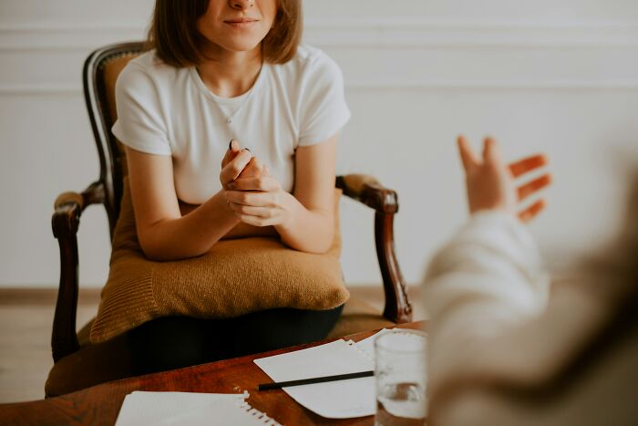 A therapist listens to a client, highlighting industry secrets in mental health care.