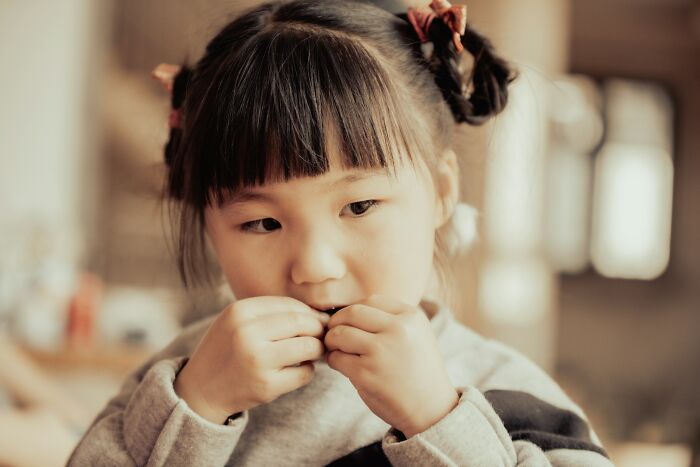 A young child eating snacks, showcasing innocent yet strange patients that medical staff often treat