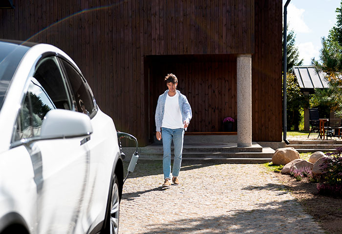 Man walks past a car, reflecting the story of a landlord refusing to return a deposit over a car. Man walks past a car, reflecting the story of a landlord refusing to return a deposit over a car.