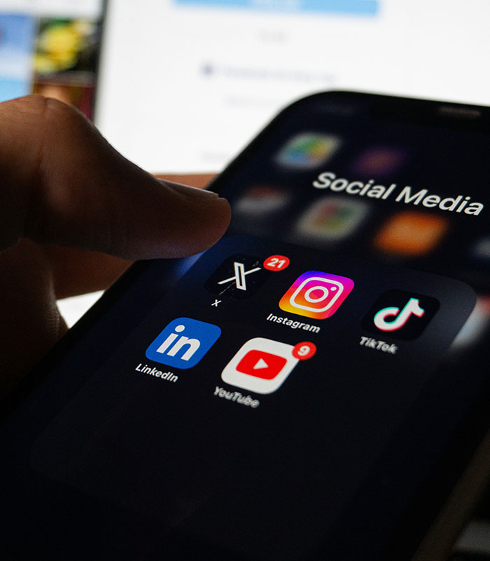 Smartphone screen displaying Instagram app icon, representing the Instagram versus reality debate.