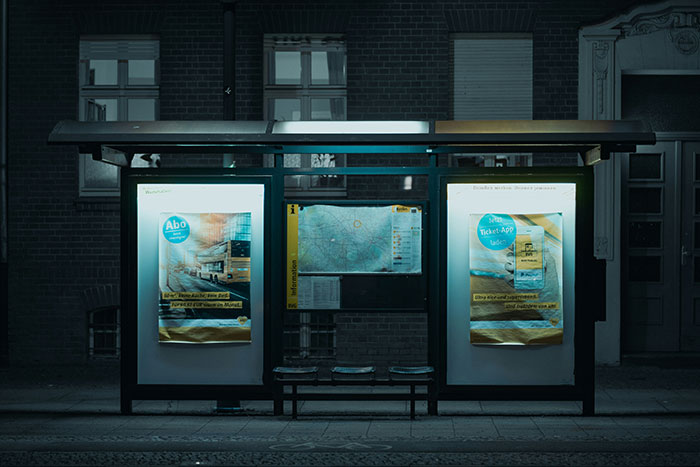 A dimly lit bus stop at night, where GF left drunk women, causing conflict with her boyfriend. A dimly lit bus stop at night, where GF left drunk women, causing conflict with her boyfriend.