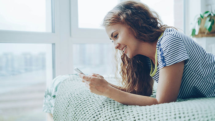 A happy girlfriend texting, she says no to driving home two drunk women who insulted her. A happy girlfriend texting, she says no to driving home two drunk women who insulted her.