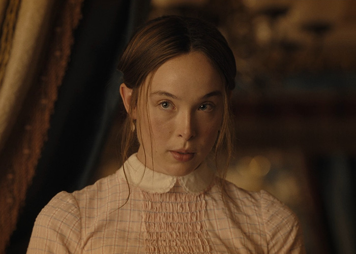 Young woman in vintage dress looking intently from Lizzie Borden series. Young woman in vintage dress looking intently from Lizzie Borden series.