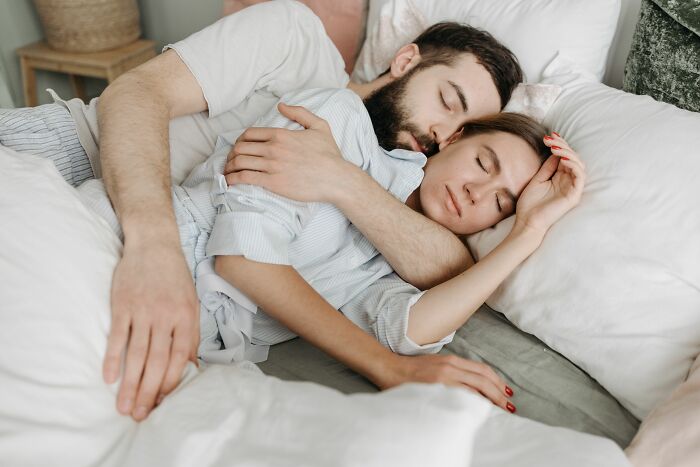 A couple sleeping peacefully, representing the harmony in a marriage that might switch after 20 years.