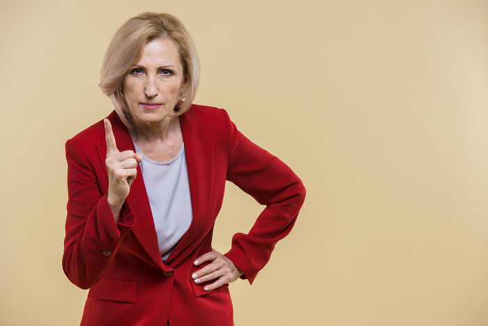 An older woman with a stern expression, warning about changes after 20 years in a marriage.