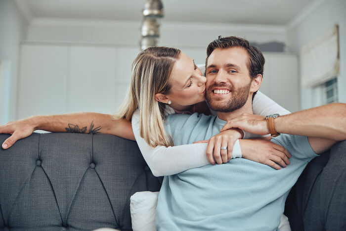 A loving couple sharing a kiss, representing the affectionate moments in a marriage that men reflect on before divorce.
