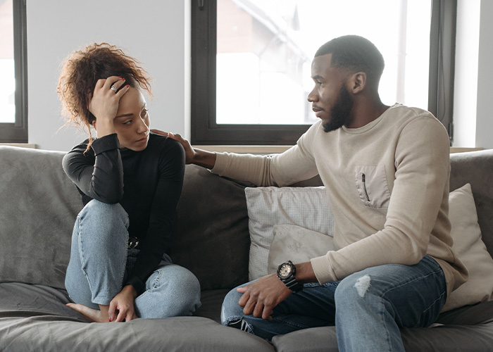 A supportive man comforting a sad woman, exemplifying how men should treat women.