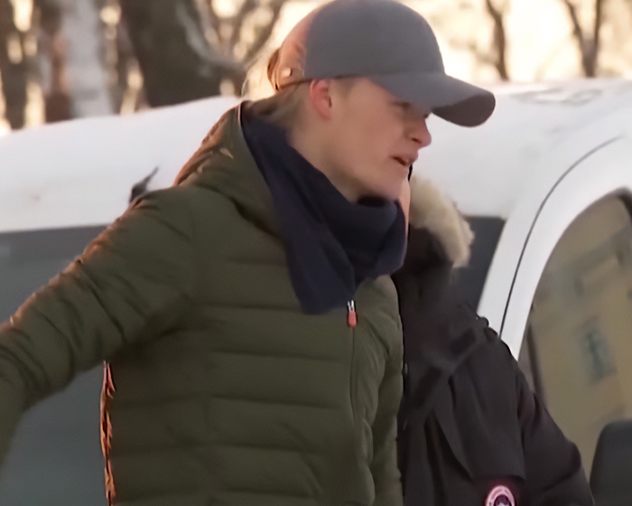 Son of Norway's Crown in a gray cap and scarf, attending a royal funeral with a crucial role.
