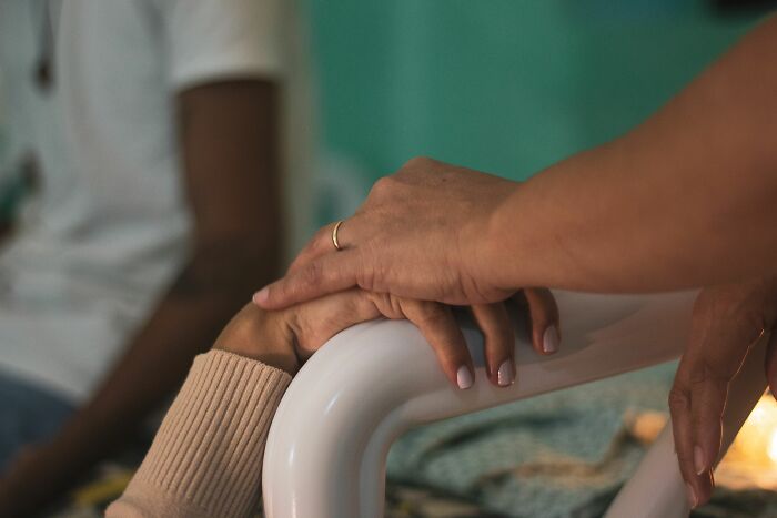 A comforting hand on a patient's arm illustrating sweet stories