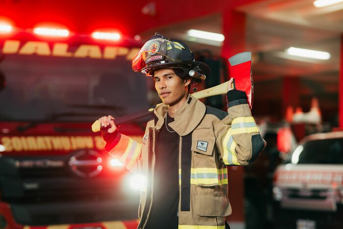 A firefighter carrying an axe, representing medical workers and emergency responders with patient stories.