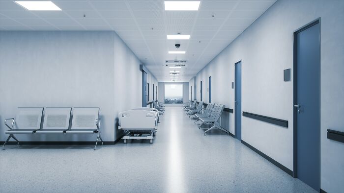 An empty hospital hallway where medical workers share stories