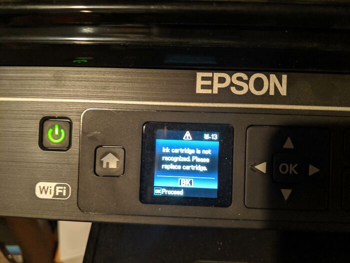 Epson printer screen showing an unrecognized ink cartridge error, a terrible product design