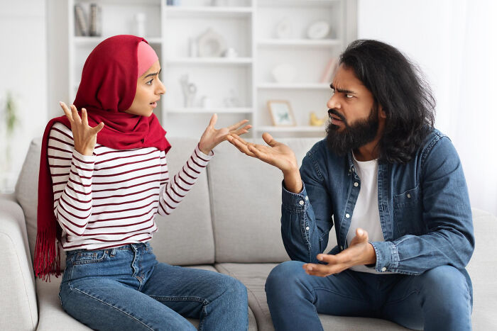 Couple in serious discussion showing conflict and toxic relationship traits