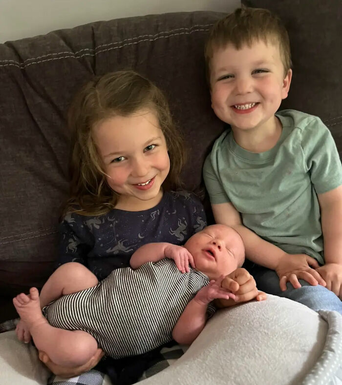 Lindsay Clancy's three children smiling together. Lindsay Clancy's three children smiling together.