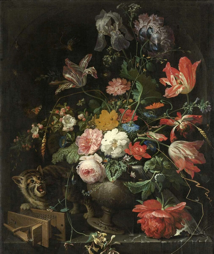 Strange famous painting of a detailed floral arrangement with a cat eyeing a mouse trap at the bottom left.