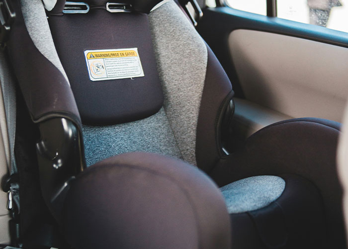 Close-up of a baby car seat inside a vehicle