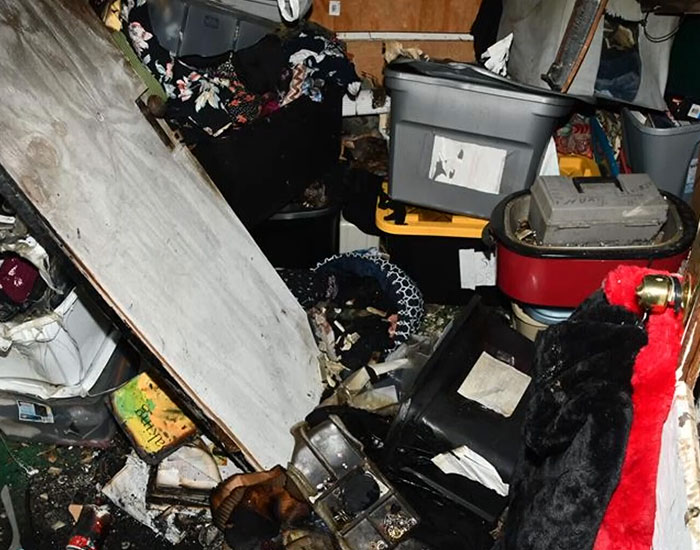 A cluttered room, showing the scene after the house ablaze incident where a stepson escaped captivity. A cluttered room, showing the scene after the house ablaze incident where a stepson escaped captivity.