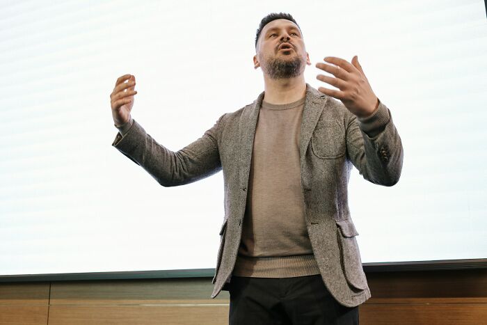 A man gesturing with his hands, making a legal excuse. This image represents ridiculous legal excuses.