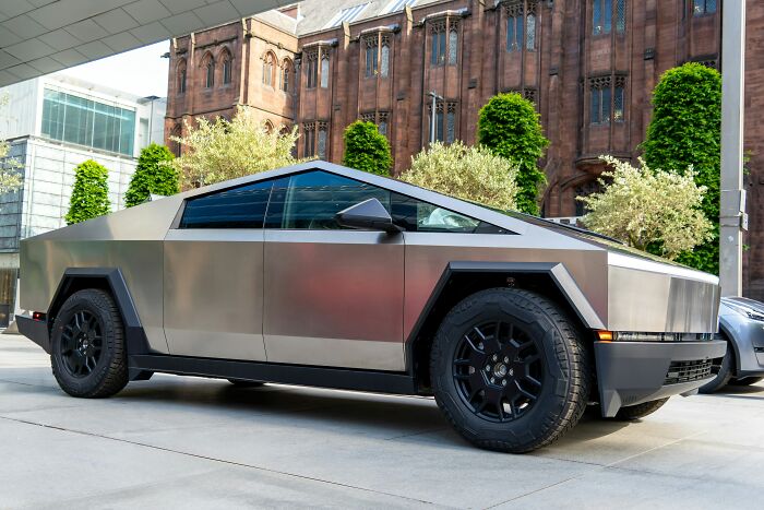 A Tesla Cybertruck parked outside, symbolizing a potential dating red flag.