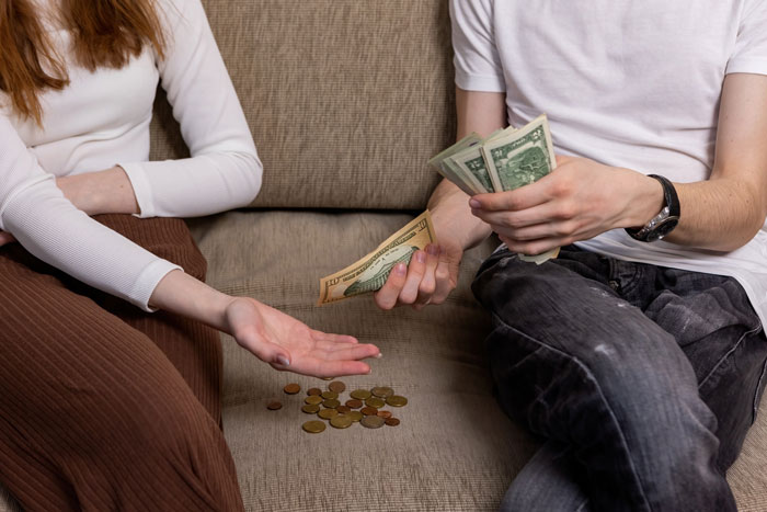 A person handing over money, illustrating a movie night side hustle A person handing over money, illustrating a movie night side hustle