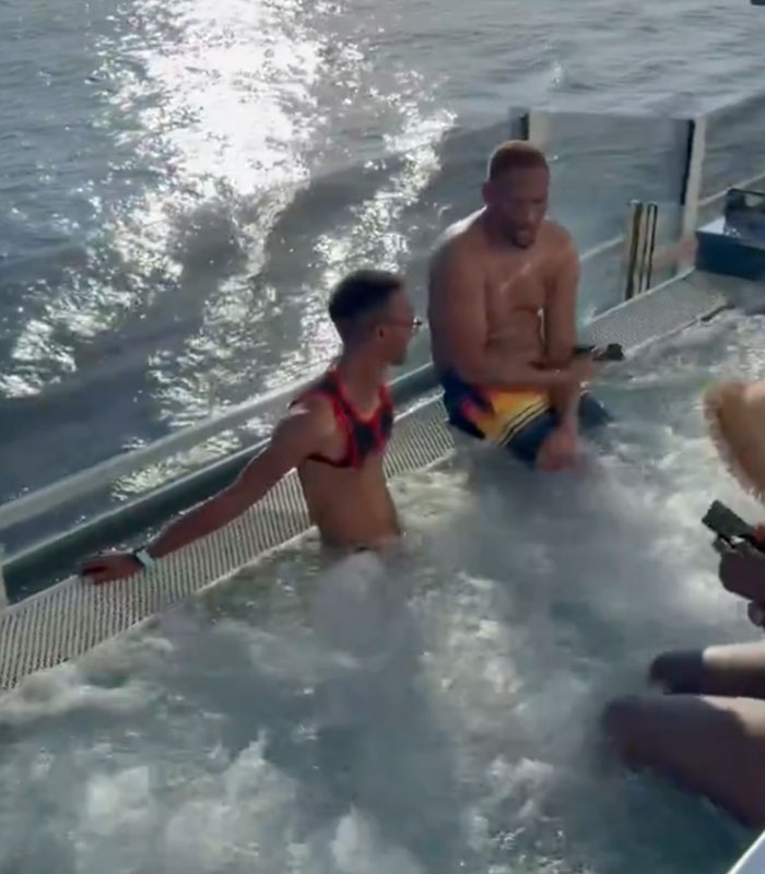 Alleged cruise ticket scammer pastor with another man in a hot tub on a cruise ship. Alleged cruise ticket scammer pastor with another man in a hot tub on a cruise ship.