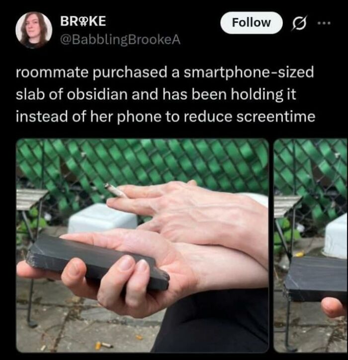 A hand holding a block of obsidian instead of a phone, an example of internet comments about screentime.