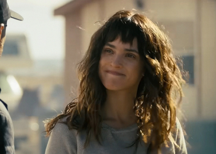 Actress Adria Arjona in a scene, discussing method acting and co-star's on-set behavior. Actress Adria Arjona in a scene, discussing method acting and co-star's on-set behavior.