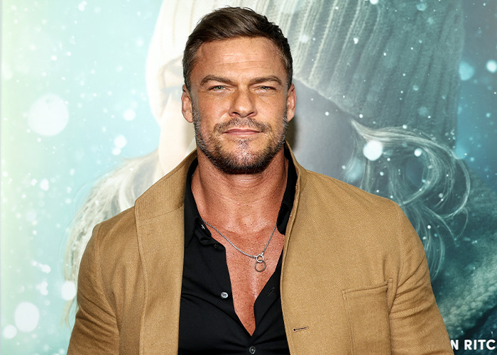 Alan Ritchson at an event, sparking rumors about his sexuality and split from wife. Alan Ritchson at an event, sparking rumors about his sexuality and split from wife.