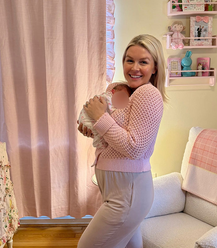 Karoline Leavitt holding a baby in a pink nursery Karoline Leavitt holding a baby in a pink nursery