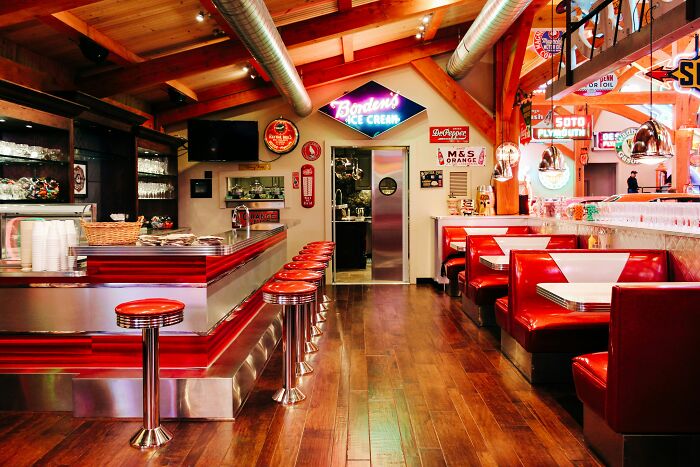 Retro diner interior with red booths and chrome stools. A diner's sixth sense smells a rat.