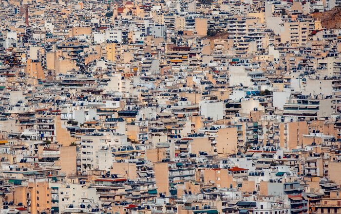 Crowded, dense cityscape of tightly packed apartment buildings, representing how easily things can escalate into a major scandal