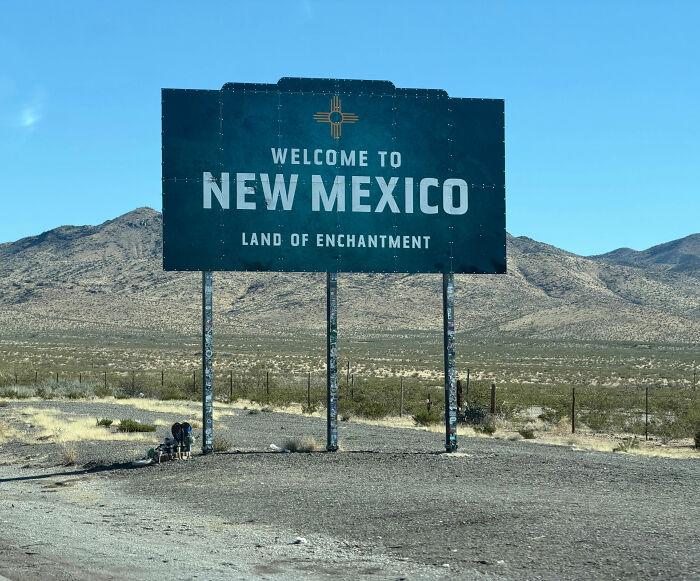 A Welcome to New Mexico sign on the side of a road, highlighting the state's identity before a potential name change. A Welcome to New Mexico sign on the side of a road, highlighting the state's identity before a potential name change.