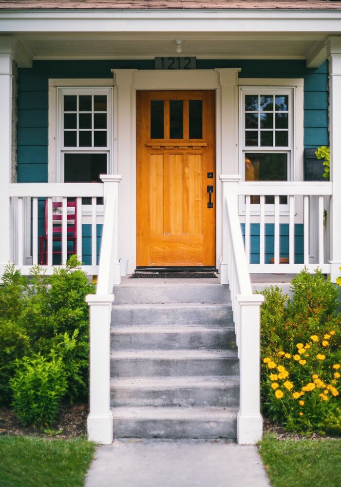 A front door of a house as a woman living alone can use safety tips to protect themselves.