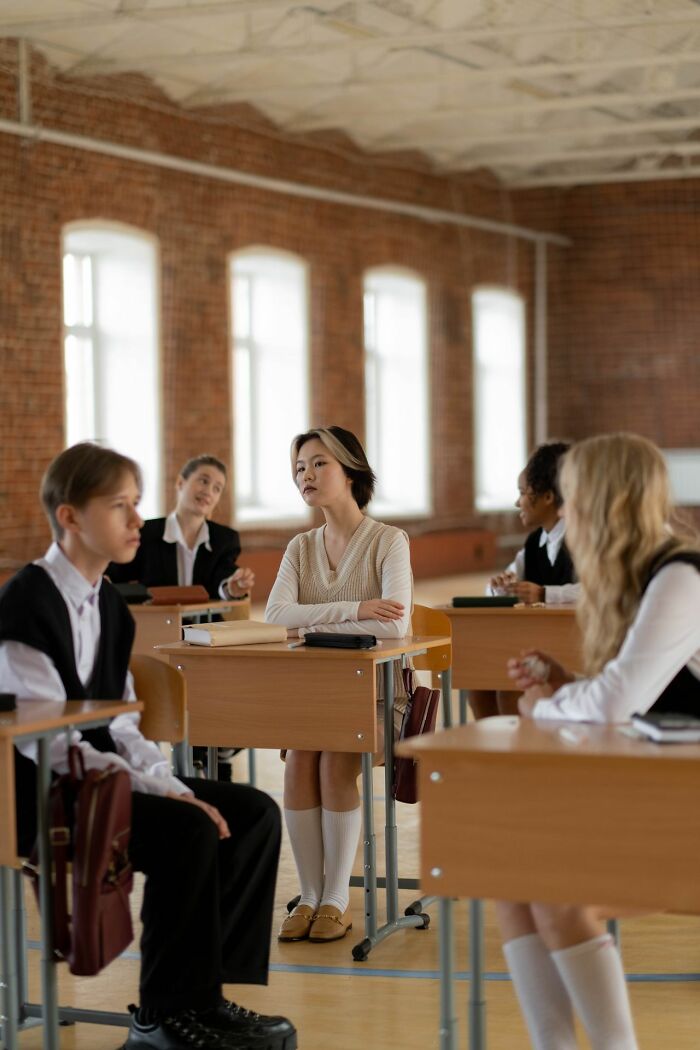 A classroom of students, focusing on simple joys no longer taken pleasure in.