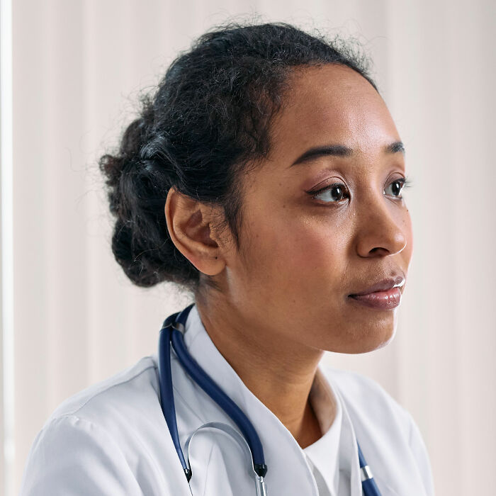 Female doctor with a stethoscope, observing health symptoms to terrify doctors.