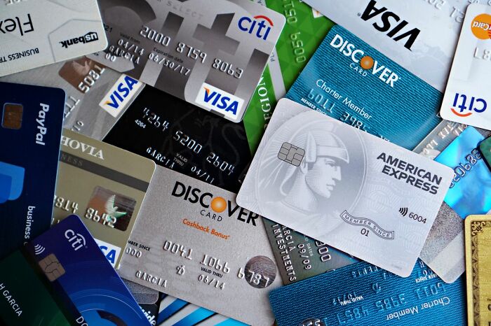 Pile of credit cards, illustrating payment methods for a delicious dinner and hot tea.