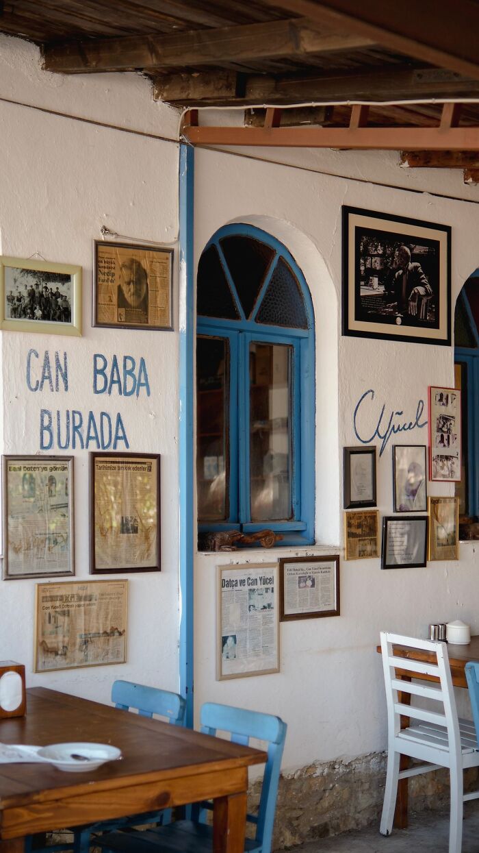 Cozy restaurant interior with pictures on the wall, ready to serve delicious dinner and hot tea.