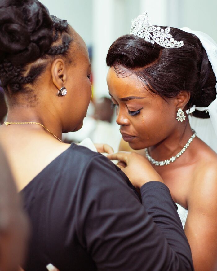 A crying bride in a wedding gown being comforted by another woman, illustrating an emotional moment people overheard.