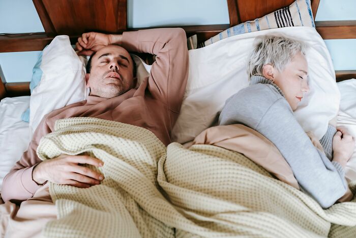 A couple sleeping soundly, emphasizing parents understanding children and their struggles.