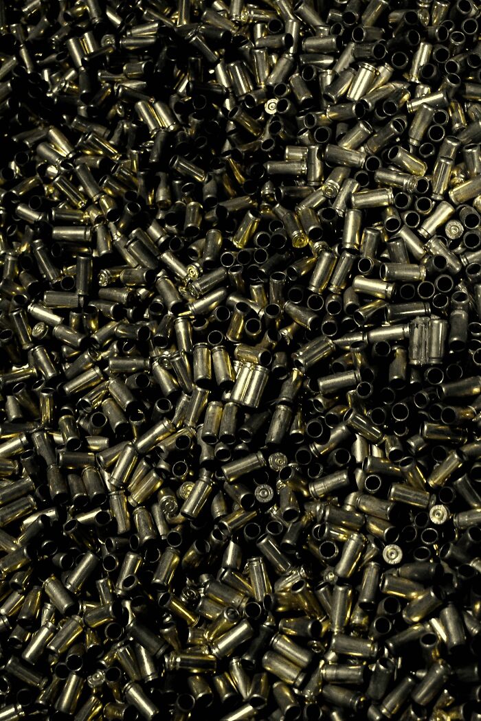A pile of spent bullet casings, symbolizing shocking industry secrets and professional knowledge.