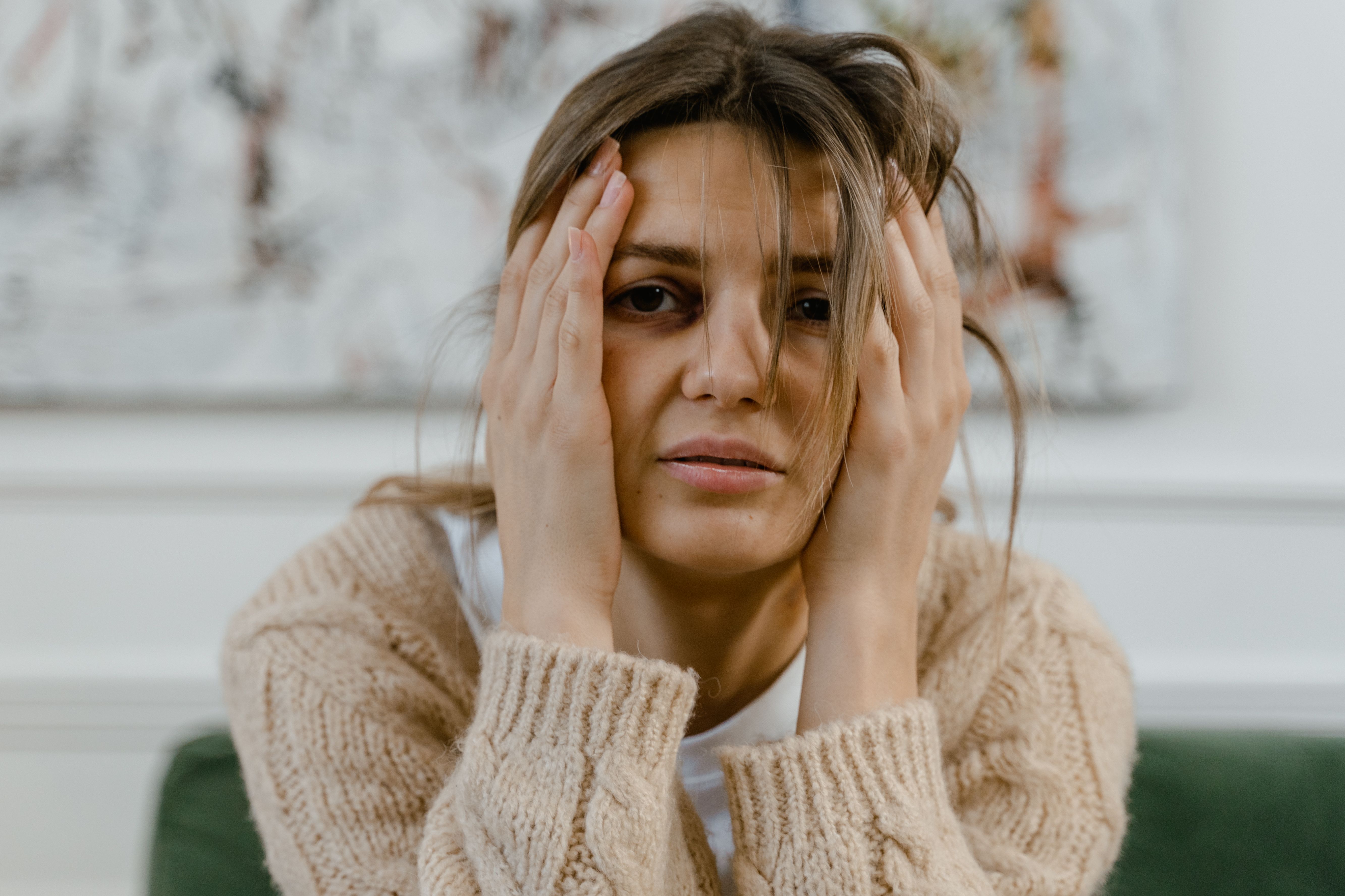 Woman stressed and overwhelmed, holding face with hands, pregnancy test disbelief emotion Woman stressed and overwhelmed, holding face with hands, pregnancy test disbelief emotion
