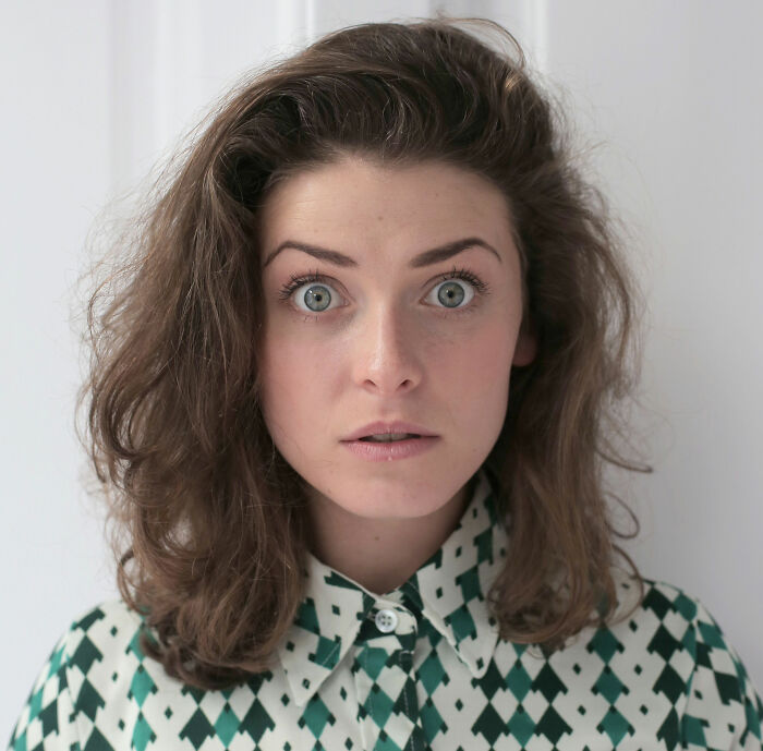 A woman with wide eyes looking shocked, highlighting crazy lies from men.