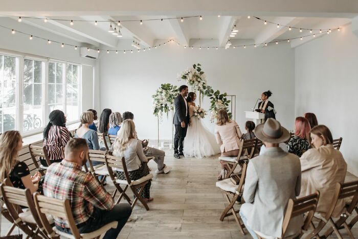 A bride and groom standing at the altar during indoor weddings