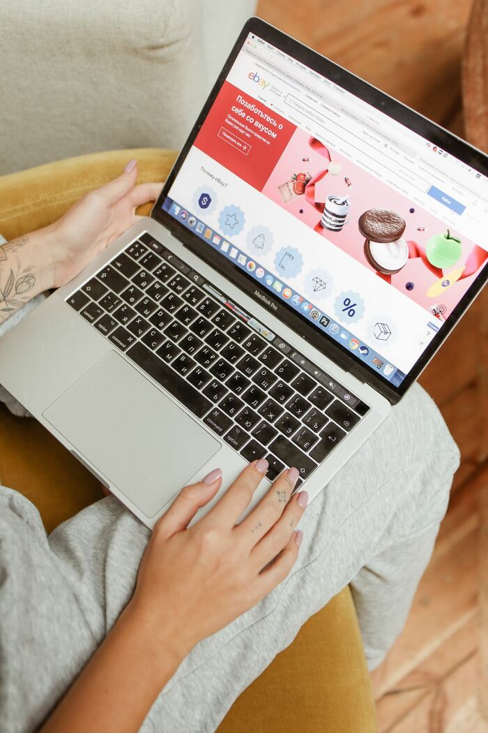 A person using a laptop for online shopping, illustrating simple joys that became mainstream.