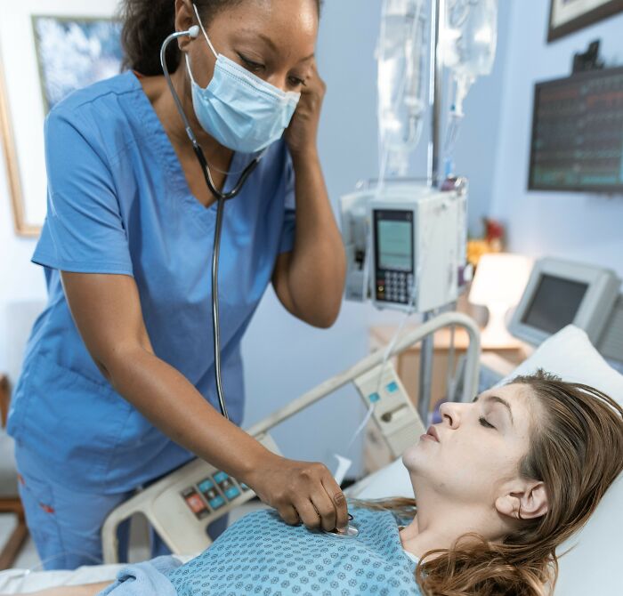 A healthcare professional examining a patient, highlighting critical health scandals